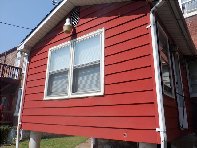 view of side of property with a balcony