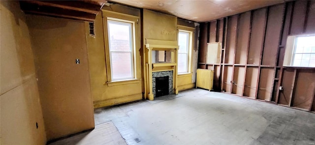 miscellaneous room featuring radiator and a fireplace