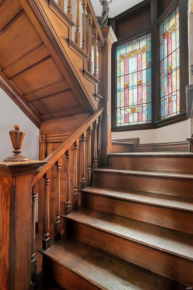 stairway with wood ceiling