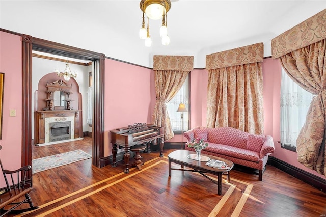 living room with a chandelier and wood-type flooring