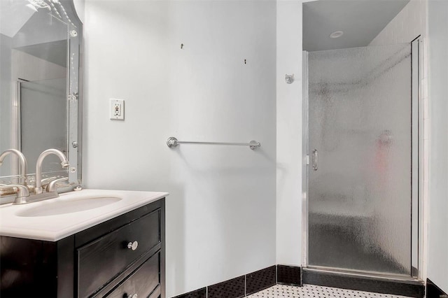 bathroom with vanity and a shower with shower door