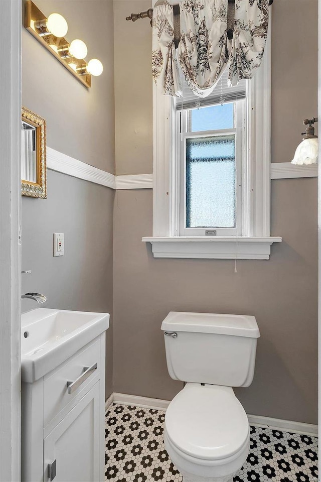 bathroom featuring vanity and toilet