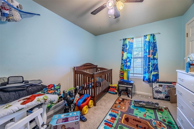 carpeted bedroom with ceiling fan