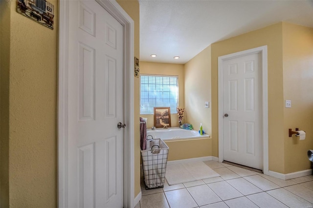 bathroom featuring a tub and tile patterned floors