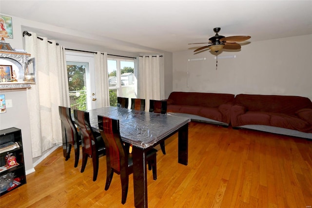 dining area featuring ceiling fan and light hardwood / wood-style flooring