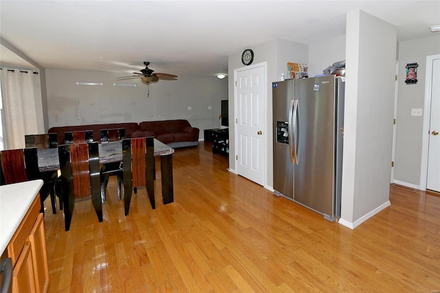 dining room featuring ceiling fan and light hardwood / wood-style flooring