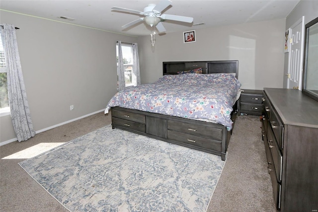 bedroom with ceiling fan and light colored carpet