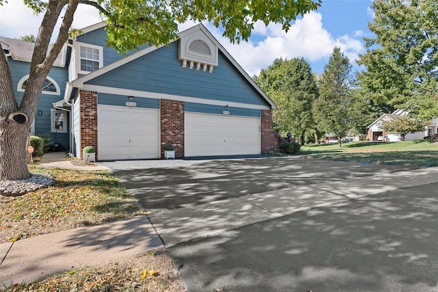 view of side of property with a garage