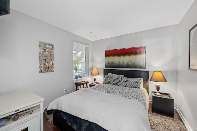 bedroom with wood-type flooring