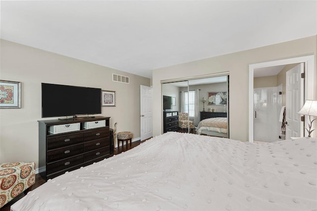 bedroom with a closet and hardwood / wood-style floors