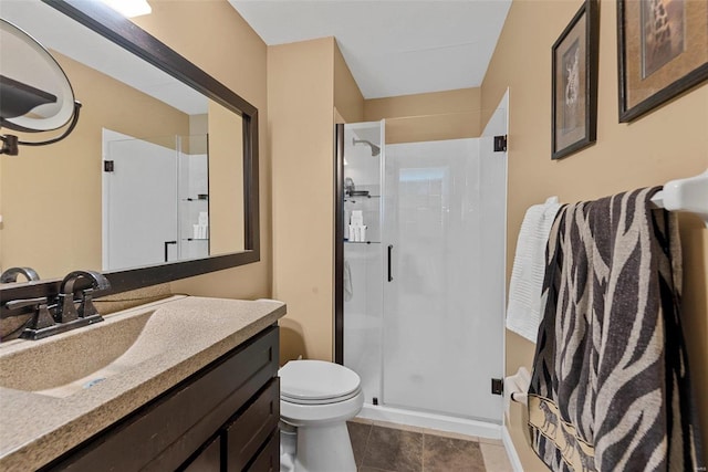 bathroom with vanity, an enclosed shower, toilet, and tile patterned flooring