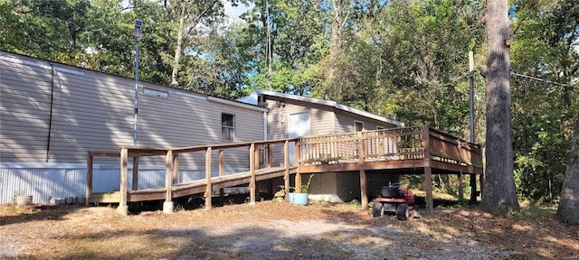 rear view of property with a deck