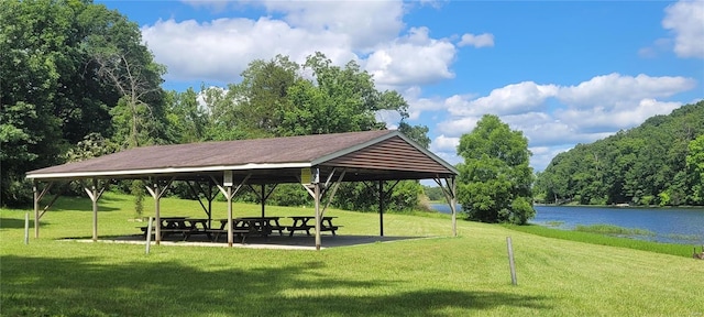 view of property's community featuring a gazebo, a lawn, and a water view