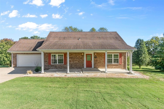 view of front of home featuring a front yard, a garage, and a porch