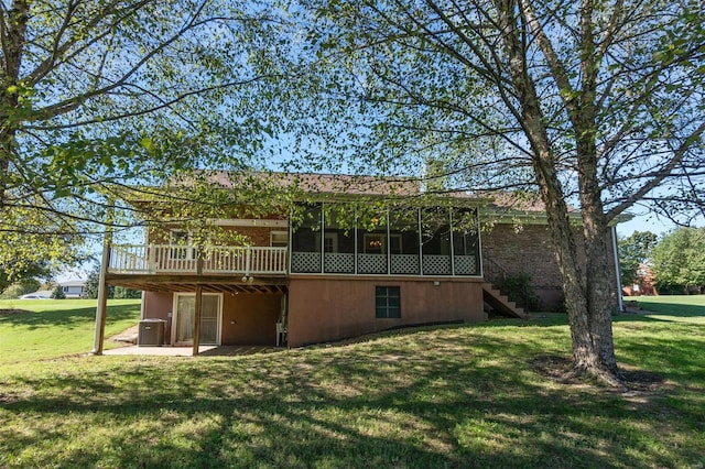 back of house featuring a yard, a patio, and central AC