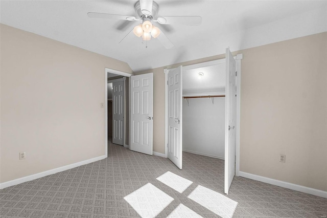 unfurnished bedroom with ceiling fan, a closet, and light carpet