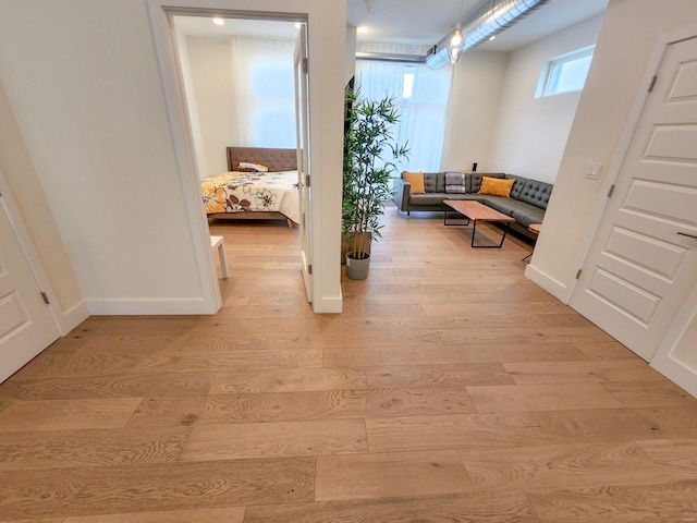 corridor featuring light hardwood / wood-style flooring