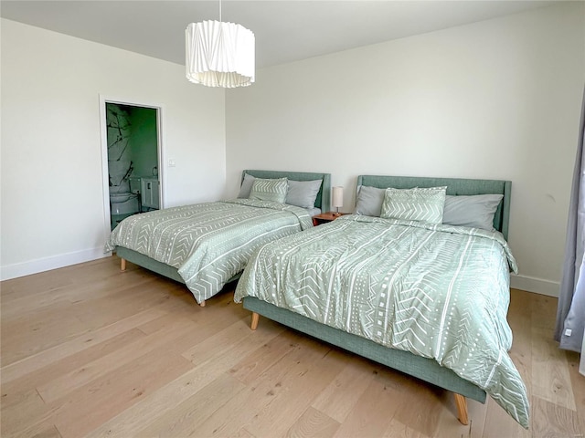 bedroom with light hardwood / wood-style floors