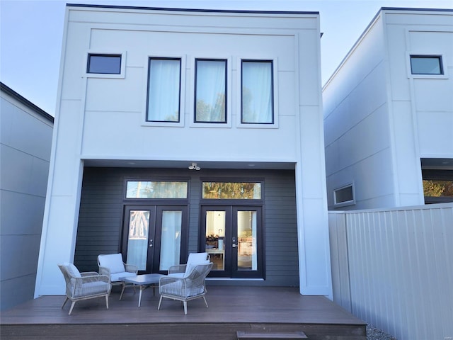 rear view of property featuring french doors