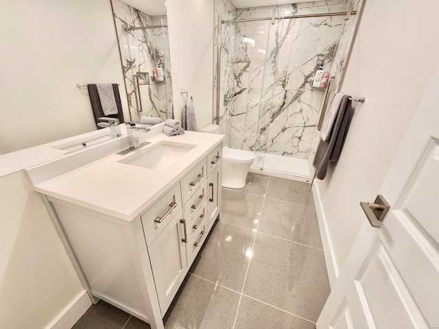 bathroom with vanity, a shower with shower door, and toilet