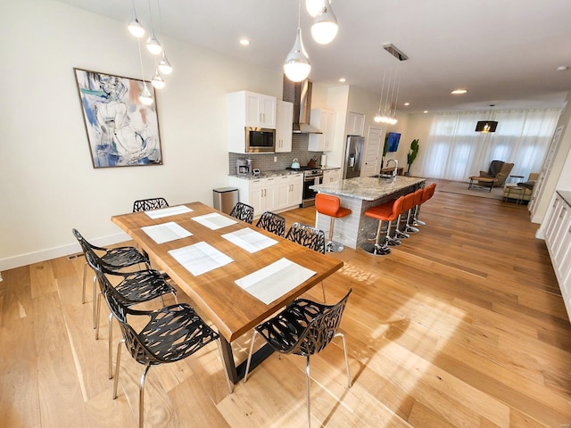 dining area featuring light hardwood / wood-style floors