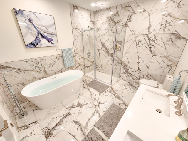 bathroom featuring tile walls, vanity, and separate shower and tub