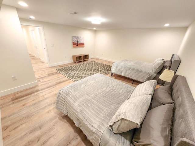 bedroom with light wood-type flooring