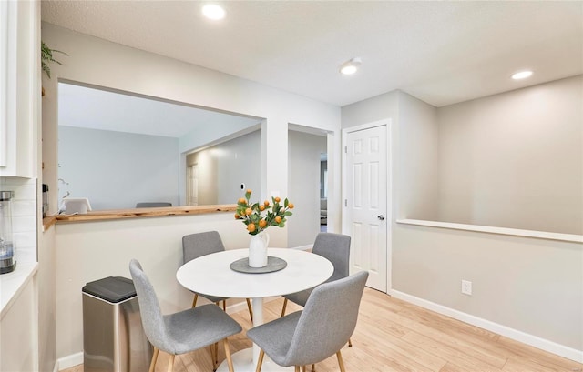 dining room featuring light hardwood / wood-style floors