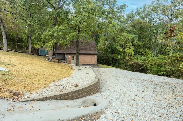 view of home's community featuring a yard and a garage