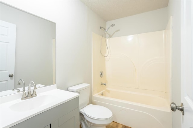 full bathroom featuring wood-type flooring, a textured ceiling, shower / bathtub combination, vanity, and toilet