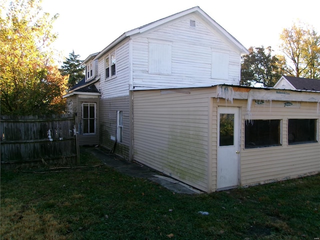 view of property exterior featuring a yard