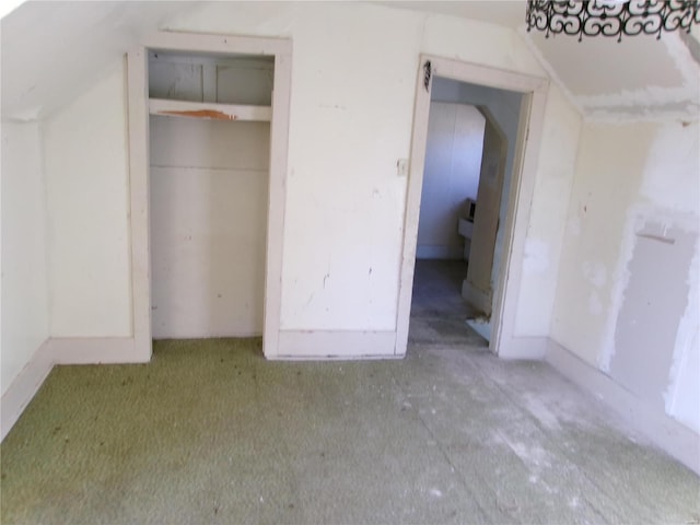 unfurnished bedroom with lofted ceiling