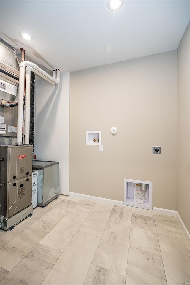 laundry area with washer hookup and electric dryer hookup