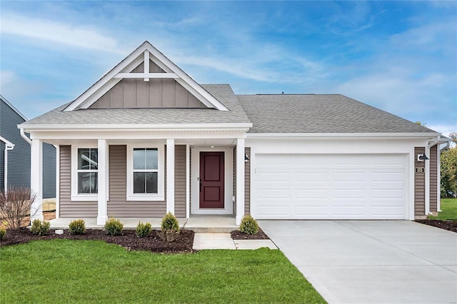 view of front facade with a garage and a front yard