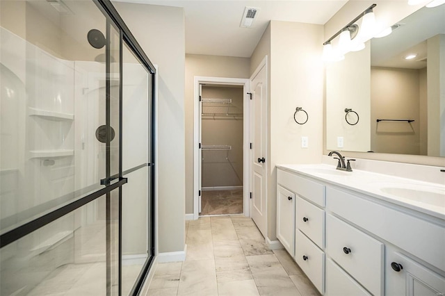 bathroom with vanity and walk in shower