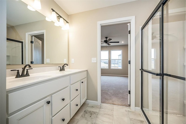 bathroom featuring vanity and a shower with door