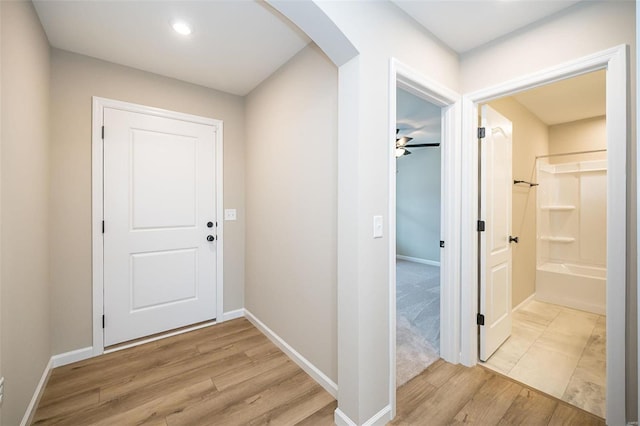 hall with light hardwood / wood-style flooring