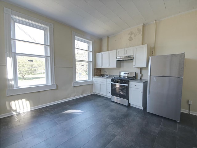 kitchen featuring white cabinets and appliances with stainless steel finishes