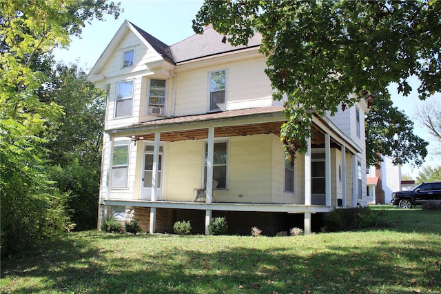 view of property exterior with a lawn, cooling unit, and a porch