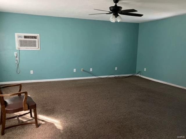 spare room with carpet, ceiling fan, and a wall unit AC