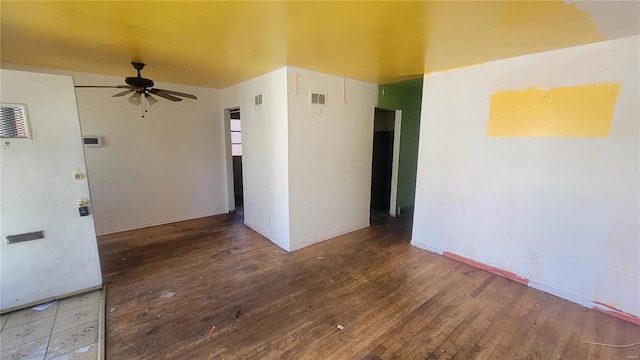 empty room featuring ceiling fan and hardwood / wood-style floors