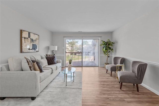 living room with light hardwood / wood-style flooring