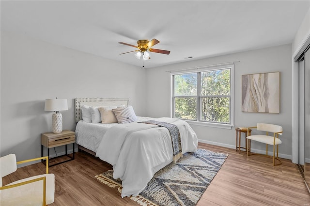 bedroom featuring light hardwood / wood-style floors and ceiling fan