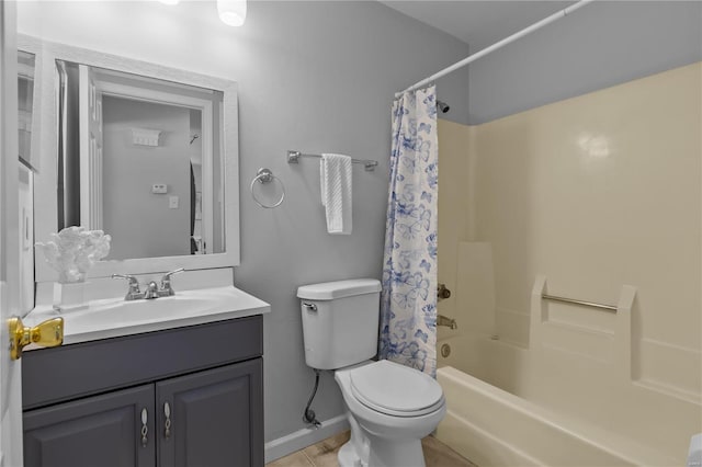 full bathroom featuring vanity, toilet, shower / bath combo with shower curtain, and tile patterned floors