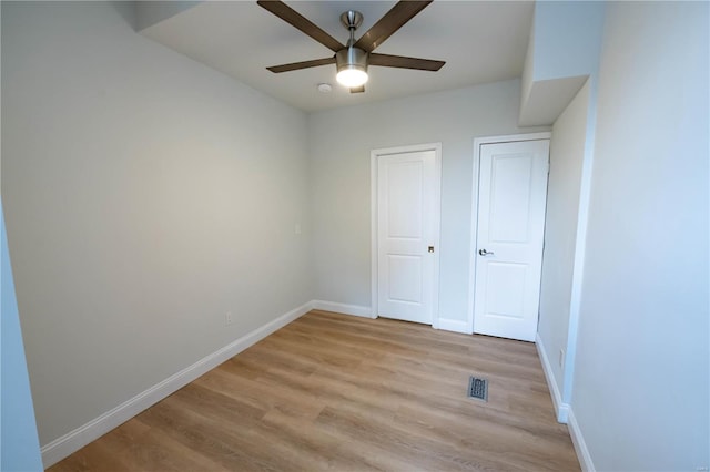 unfurnished bedroom with light wood-type flooring and ceiling fan