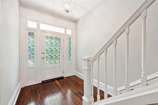 foyer entrance featuring dark hardwood / wood-style floors and a wealth of natural light