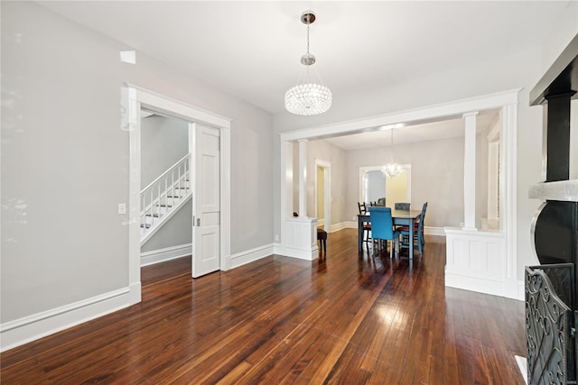 dining space featuring a chandelier and dark wood-type flooring