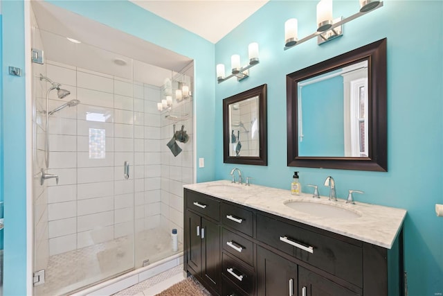 bathroom featuring an enclosed shower and vanity