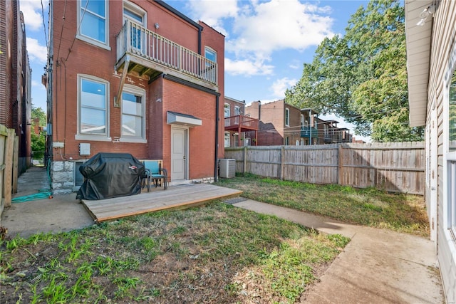 view of yard featuring a balcony and a patio area