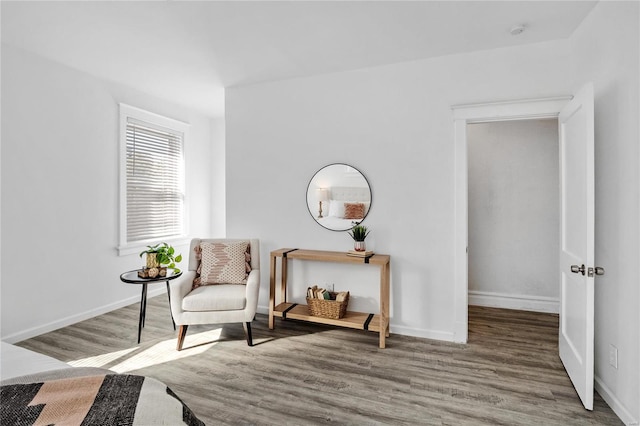 living area with hardwood / wood-style floors